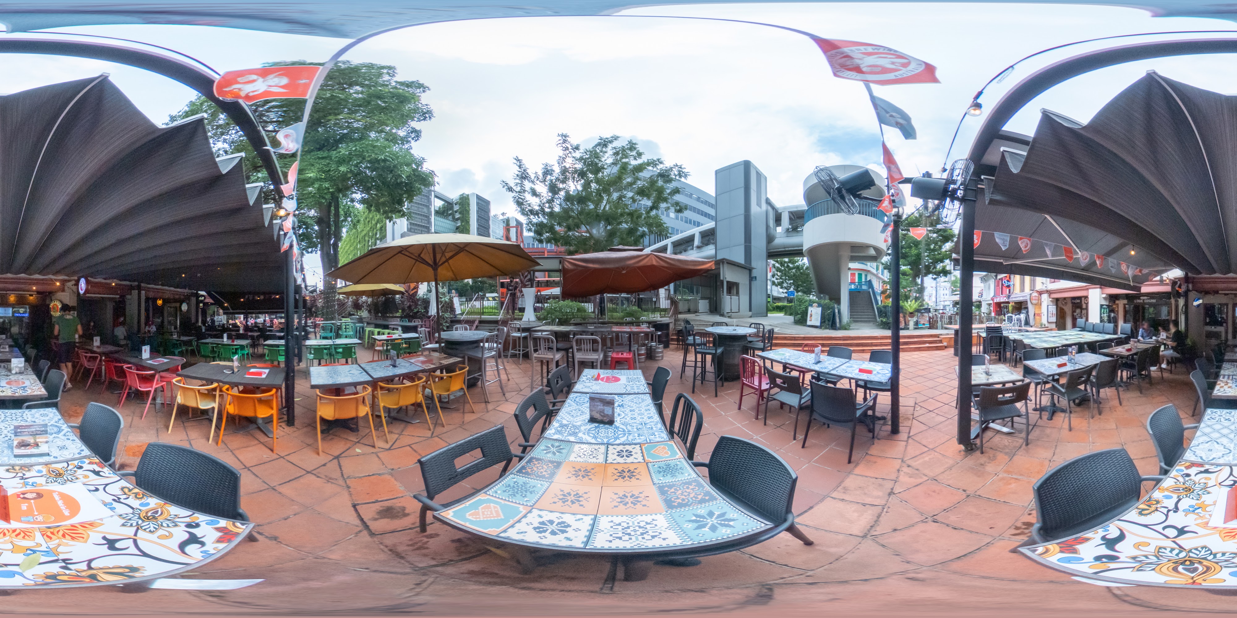 Chairs, Tables, and Umbrellas Outside.
