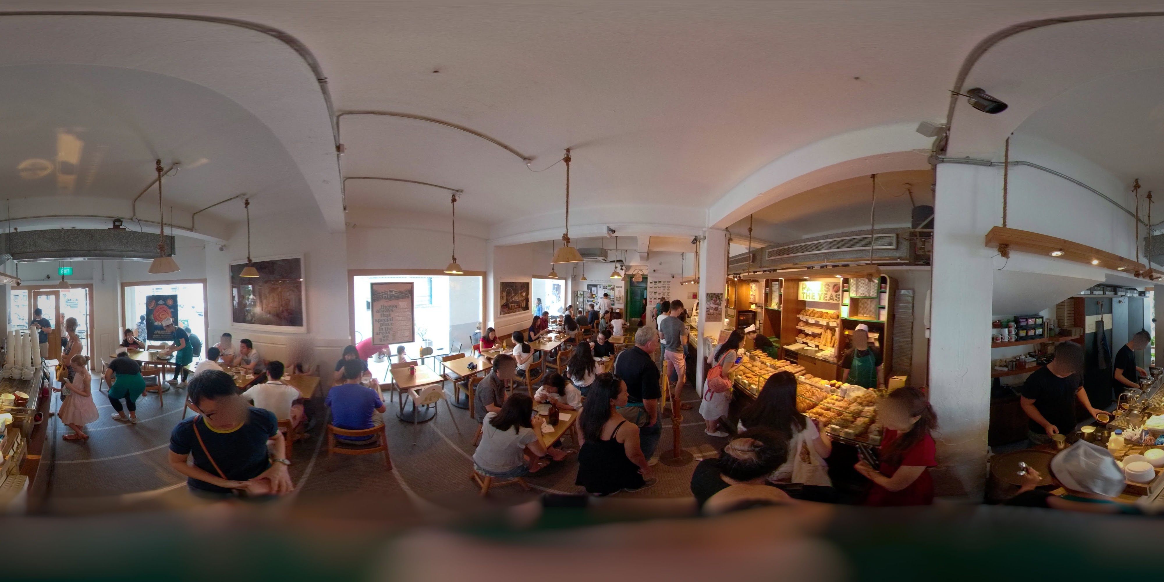 Bustling Café with Bread Display