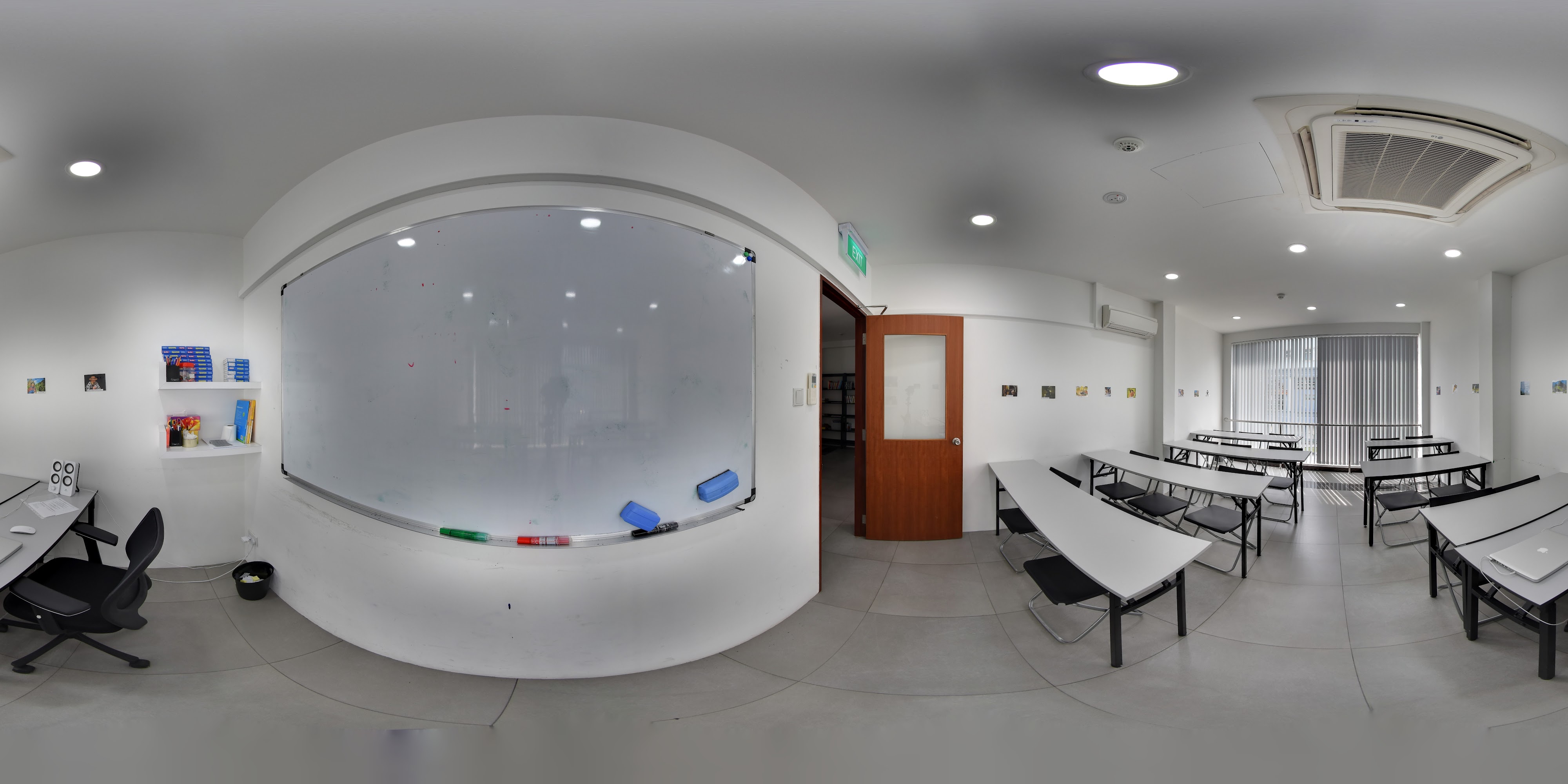 Educational Space with Curved White Wall