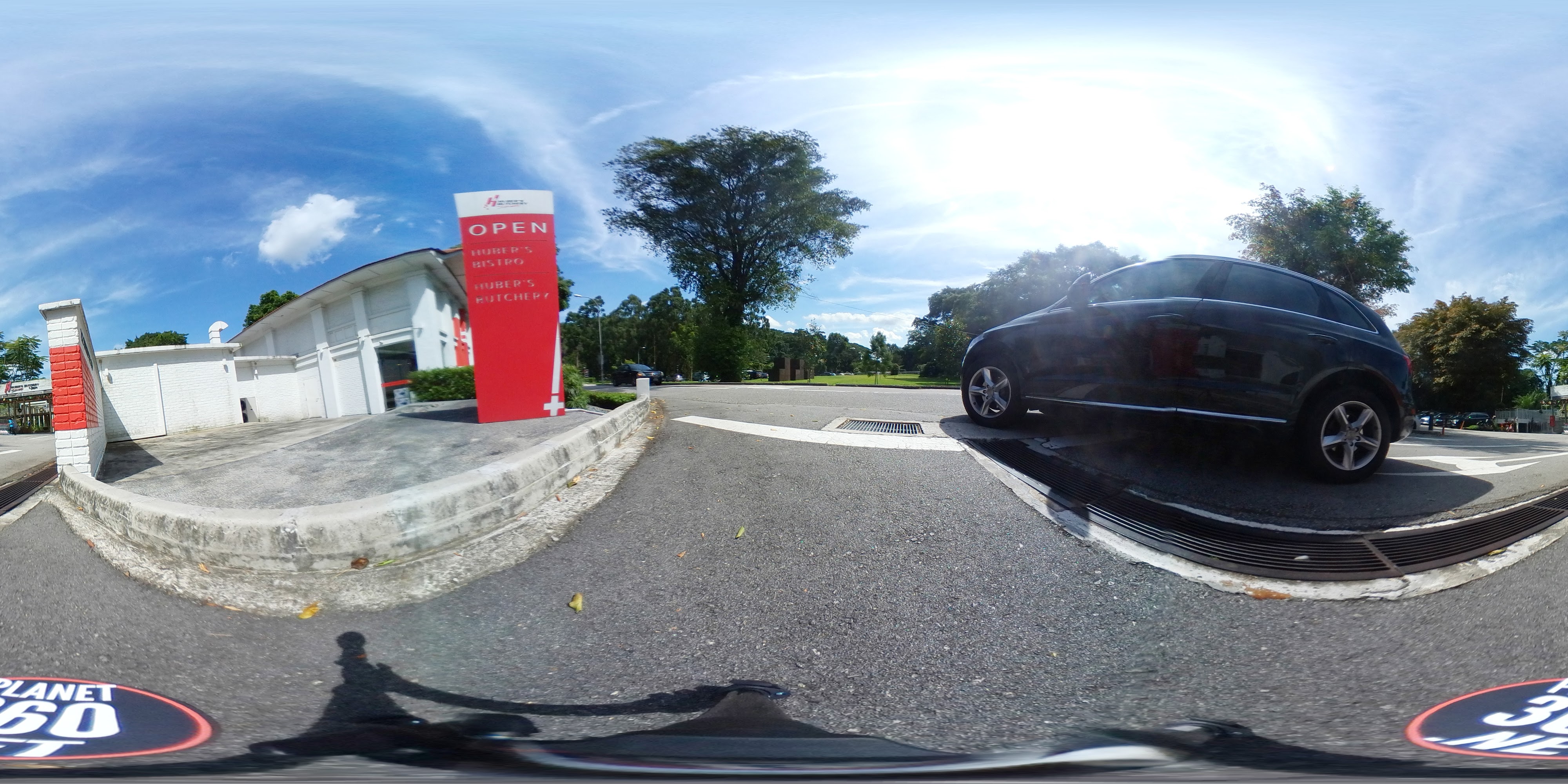 Red Sign Near Busy Rotary